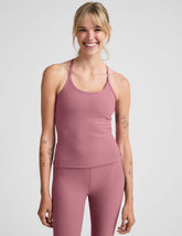 pink waist length racerback tank with slim straps.
